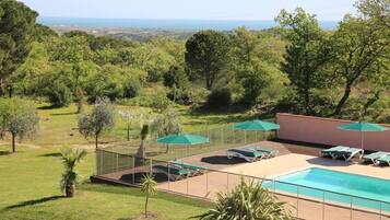 Seasonal outdoor pool, pool umbrellas, pool loungers