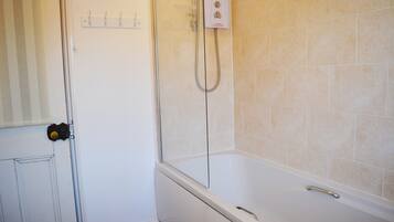 Hair dryer, towels, shampoo, toilet paper