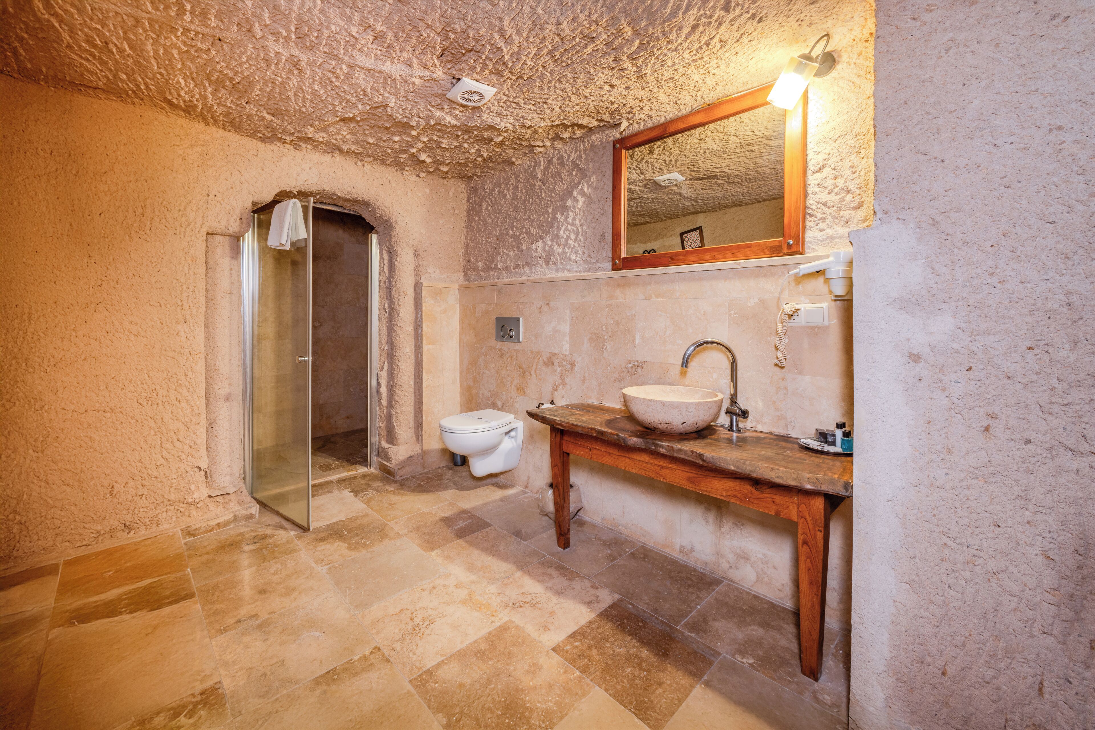 cave room, jacuzzi | bathroom | free toiletries, hair dryer, bathrobes, slippers