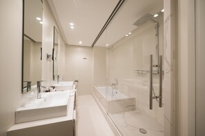 Luxury King Room | Bathroom | Designer toiletries, hair dryer, bathrobes, slippers