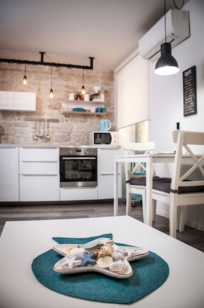 City Apartment | Private kitchen | Electric kettle, cleaning supplies