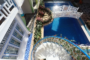Seasonal outdoor pool, open noon to 6:00 PM, pool umbrellas