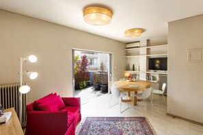 Business Apartment, 1 Bedroom, Balcony, City View (2nd floor, stair access only) | Living area | Flat-screen TV - Elegant and Airy Apartment One Stop from City Center by VillaRentalsgr (Athens)