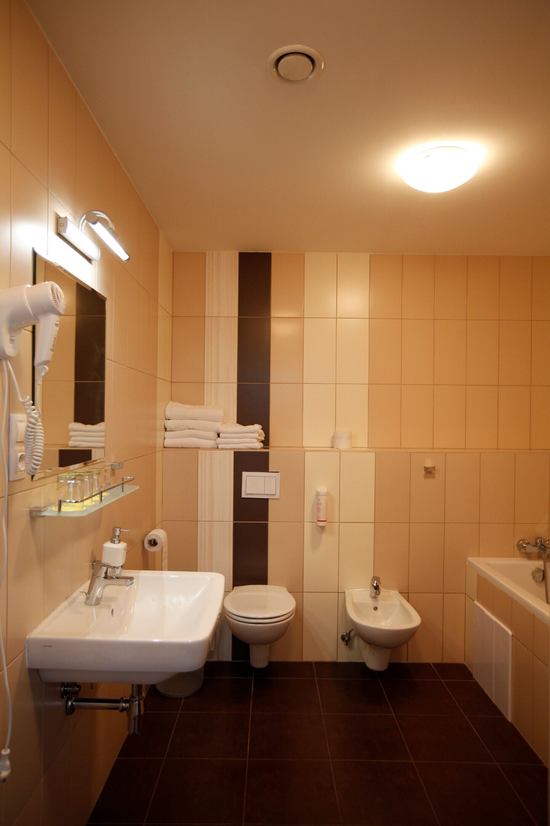 quadruple room | bathroom | shower, hair dryer, towels, soap