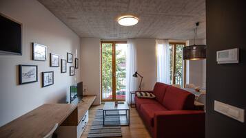 Departamento de diseñador, 1 habitación (2) | Área de sala de estar | Televisión de pantalla plana