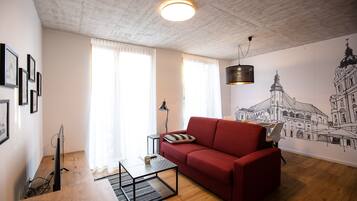 Design Apartment, 1 Bedroom (2) | Living room | Flat-screen TV