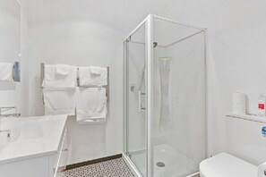 Bathtub, hair dryer, towels, soap