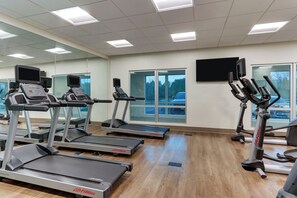 A gym with treadmills, ellipticals, and exercise bikes. - Holiday Inn Express & Suites Middletown - Goshen by IHG (Middletown)
