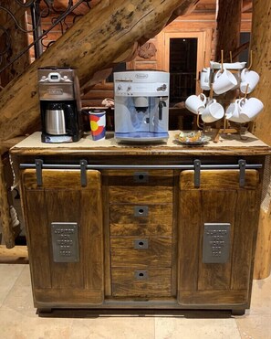 The cabinet features metal handles and two drawers with metal latches.