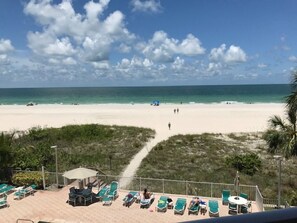 On the beach, sun loungers, beach towels