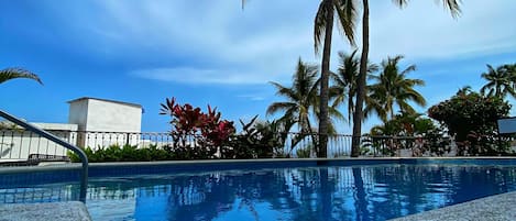 Outdoor pool, pool umbrellas, sun loungers