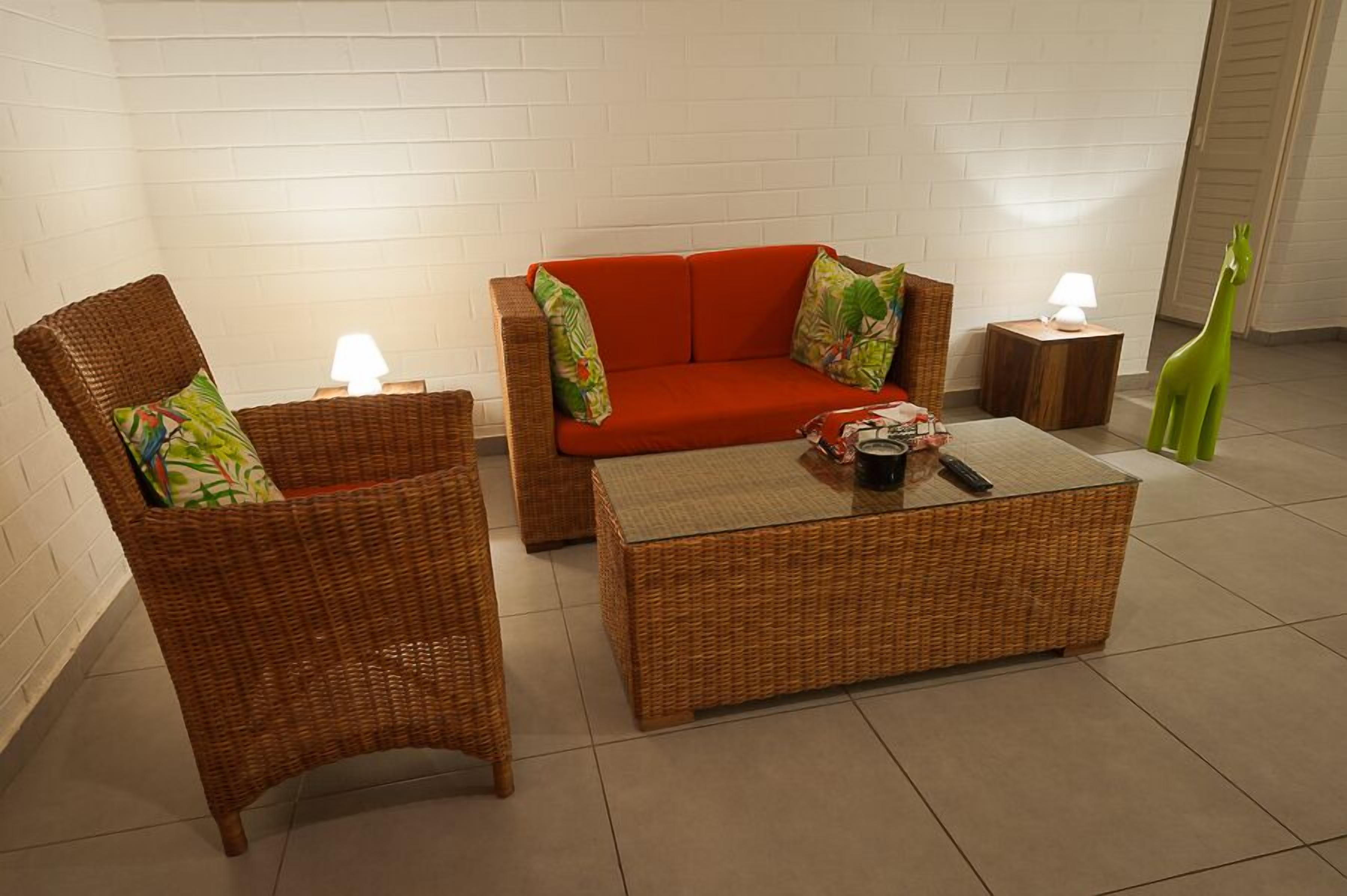 deluxe double room, river view | living area | ping pong