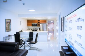 Luxury Apartment, 1 Bedroom, Non Smoking | Living room | 50-inch flat-screen TV with cable channels, TV, DVD player