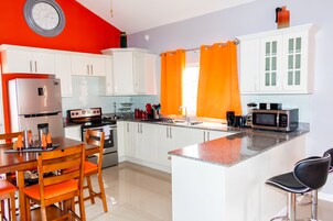 Family Villa, Multiple Beds, Non Smoking | Private kitchen | Coffee/tea maker, full-size fridge, microwave, oven