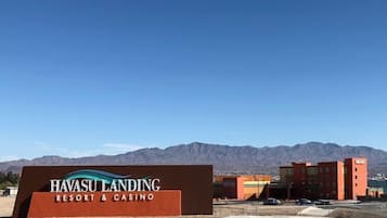 A sign for Havasu Landing Resort & Casino with a mountainous backdrop.