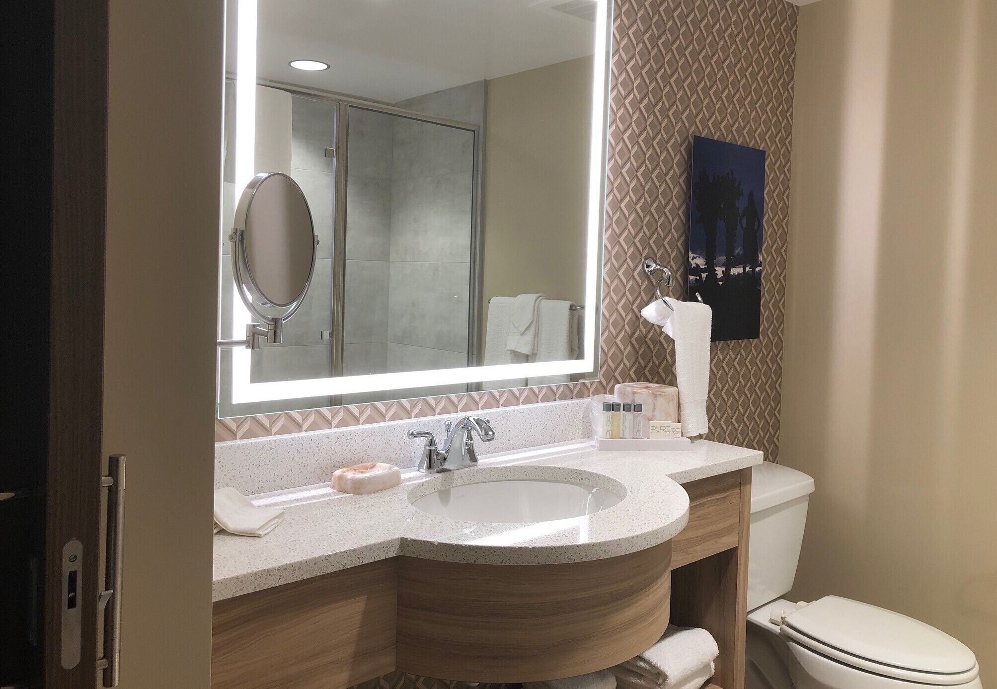 designer toiletries, hair dryer, towels, soap