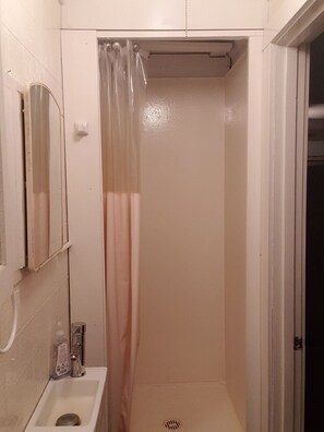 Shower, towels, soap, toilet paper