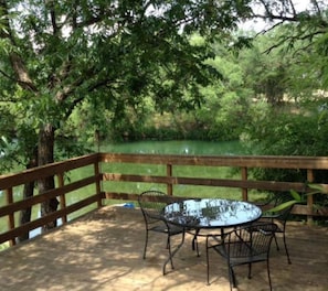 Outdoor dining - Our cabins are located on the crystal clear water of Spring Creek. (Mertzon)