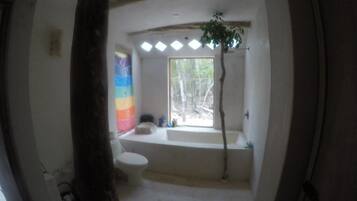 Combined shower/bathtub, towels, soap, toilet paper
