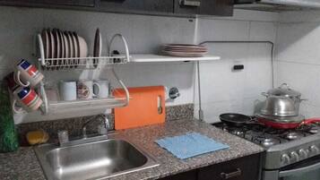 Family Apartment, 3 Bedrooms | Private kitchen | Full-sized fridge, oven, stovetop, cookware/dishes/utensils