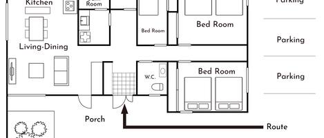 A floor plan with a kitchen, living-dining area, two bedrooms, a bathroom, a terrace, a W.C., and parking spaces.