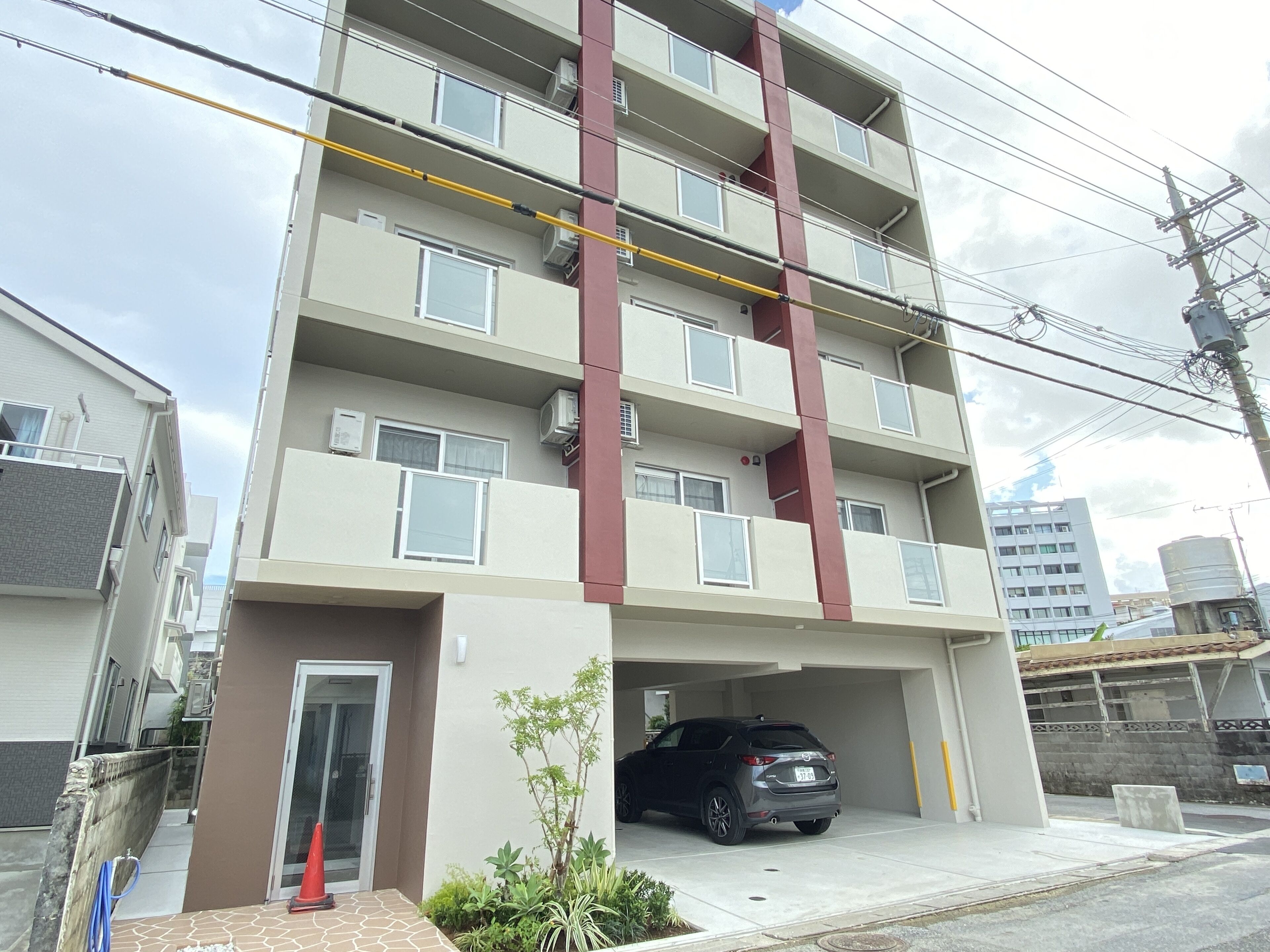 A multi-story residential building with a parking garage.