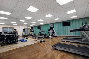 A gym with treadmills, stationary bikes, and weight machines. - Holiday Inn Express & Suites Milwaukee - Brookfield by IHG (Brookfield)