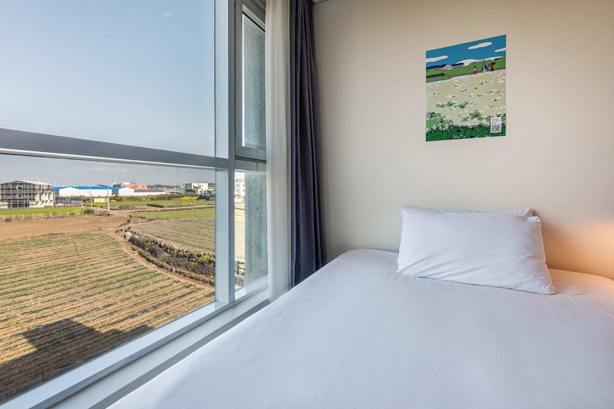 deluxe room, 2 double beds, non smoking, garden view | 1 bedroom, desk, laptop workspace, blackout curtains