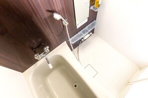 Separate tub and shower, free toiletries, hair dryer, slippers