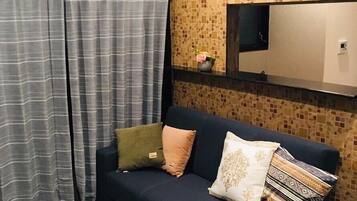 Plum Ark Apartment 203 | Living area | Flat-screen TV