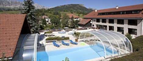 Seasonal outdoor pool, pool loungers