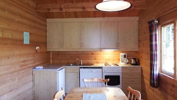 Cabin | Private kitchen | Fridge, microwave, oven, stovetop