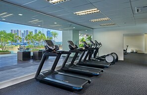 A modern gym with treadmills, a rowing machine, and exercise balls. - Wyndham Acmar Klang (Klang)