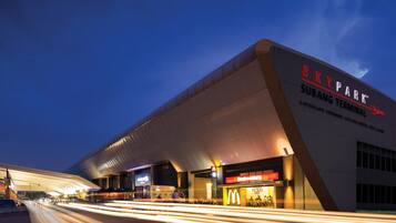 A modern building with the sign 'SKY PARK SUBANG TERMINAL' and a McDonald's restaurant.
