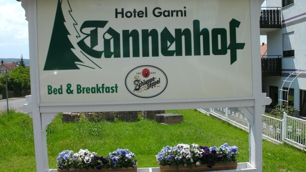 A sign for Hotel Garni Tannenhof indicating it offers bed and breakfast services. - Tannenhof (Erlenbach am Main)