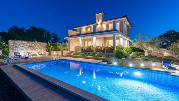 A modern two-story house with a swimming pool, stone walls, and outdoor seating. - Villa Almedina - perfect holiday destination with a pool, whirlpool and sauna by MyWaycation (Ljutici)