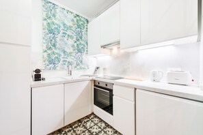 Departamento, 2 habitaciones | Cocina privada | Refrigerador con congelador, microondas, horno y lavavajillas 