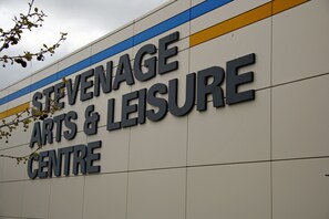 A building with the sign "Stevenage Arts & Leisure Centre". - Stevenage Apartments (Stevenage)