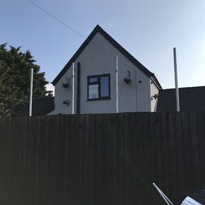Stylish single-story home with a pitched roof and a charming window.