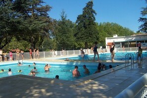 Seasonal outdoor pool, open noon to 6:30 PM, pool umbrellas