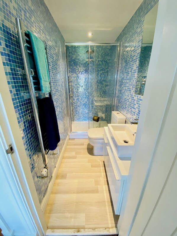 Combined shower/tub, hair dryer, towels, soap