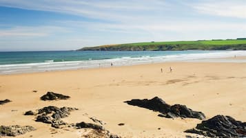 On the beach, sun-loungers