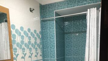 Bathtub, hair dryer, bidet, towels