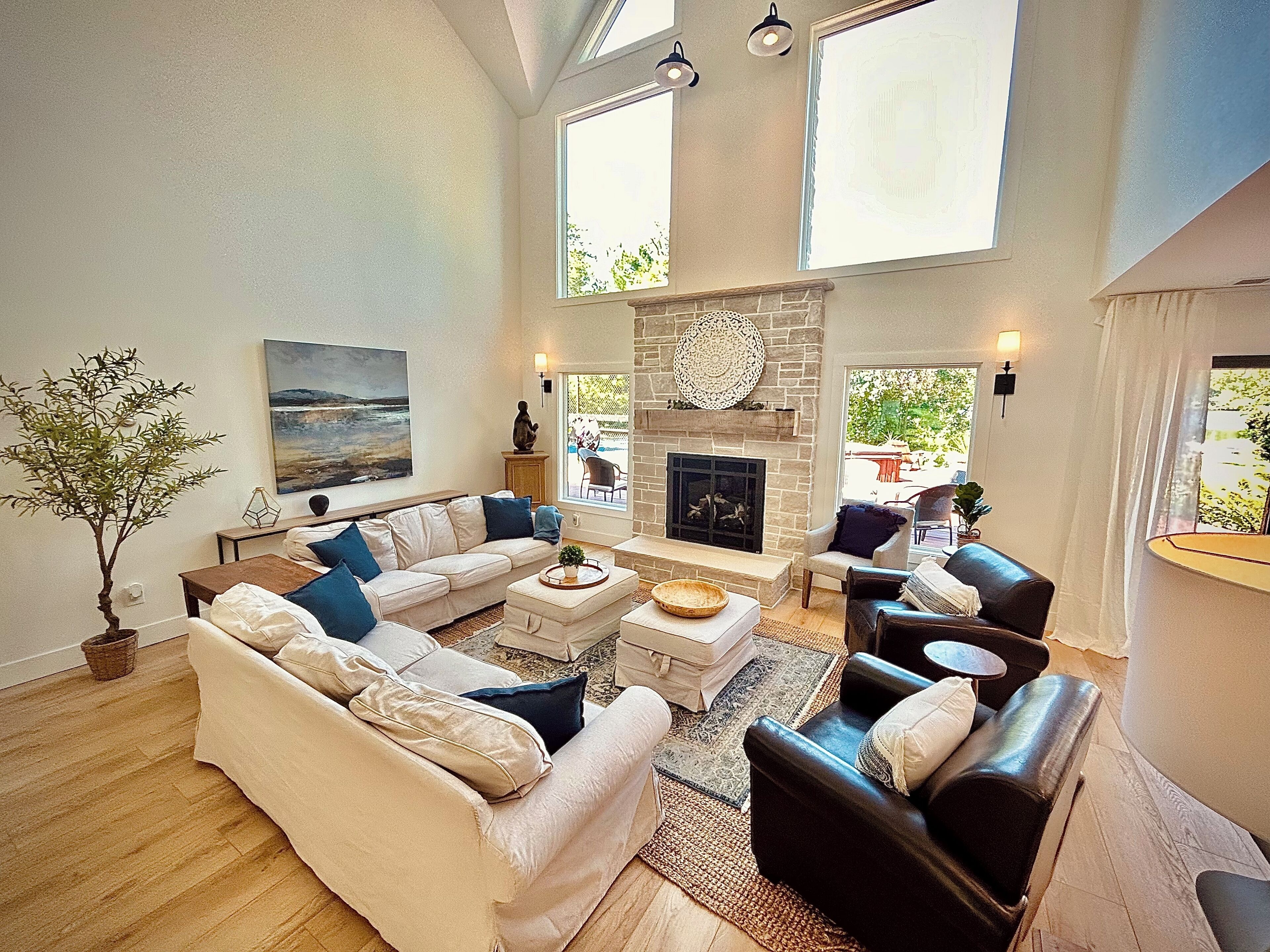 Open living dining and kitchen with limestone fireplace and lake views!