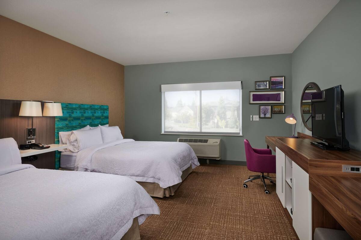 Premium bedding, pillow-top beds, desk, blackout curtains