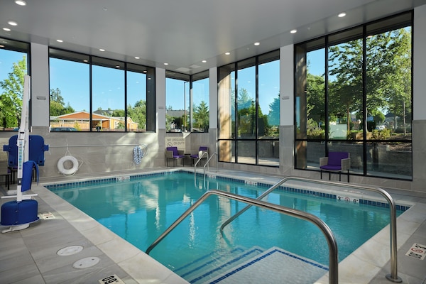 Indoor pool, open 7:00 AM to 11:00 PM, pool loungers