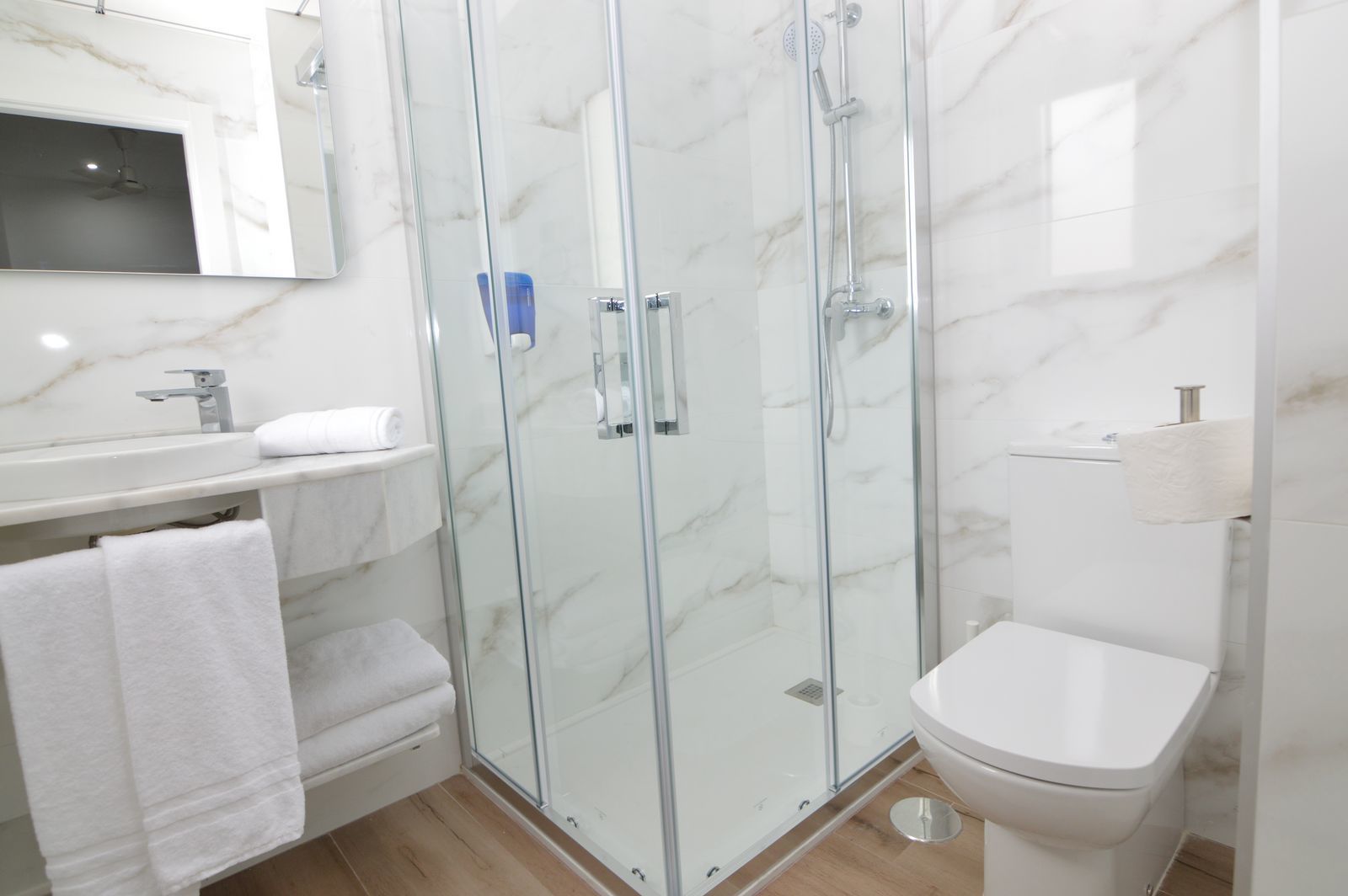 rainfall showerhead, hair dryer, towels, soap