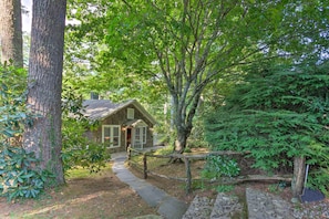 Escape to a tranquil retreat nestled in a lush forest, surrounded by nature's serenity.