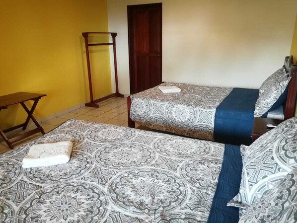 Desk, laptop workspace, bed sheets, wheelchair access