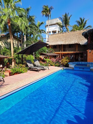 Outdoor pool, open 7:30 AM to 10:00 PM, pool umbrellas, pool loungers - Hotelito Swiss Oasis - Adults Only (Puerto Escondido)